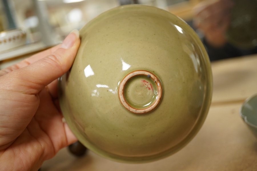 A Chinese celadon glazed box and cover and two similar bowls, largest 15cm diameter. Condition - varies